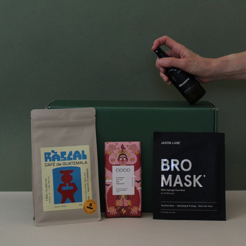 gift for new dad with coffee, face mask, chocolate and energy spray