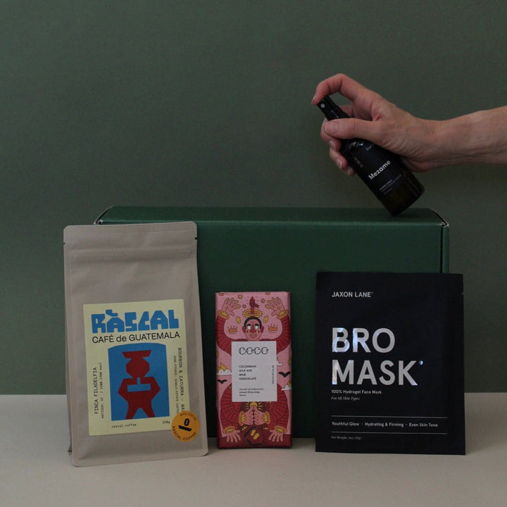 gift for new dad with coffee, face mask, chocolate and energy spray