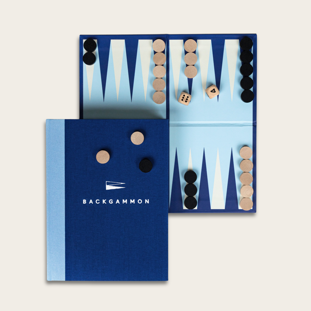 Backgammon set with pieces and dice in a blue case