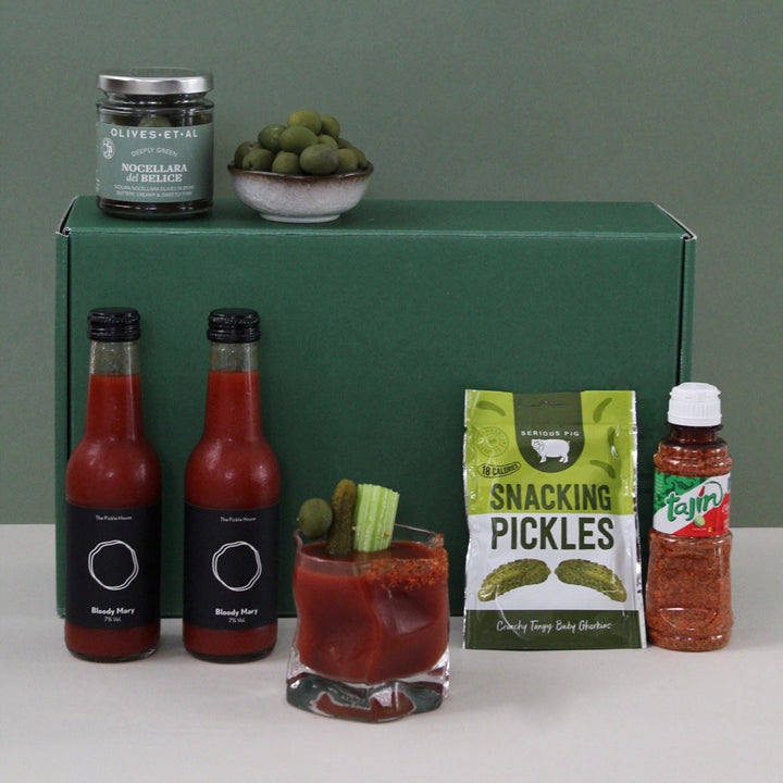 Spicy Bloody Mary gift with bottles, a glass, pickles, olives and seasoning