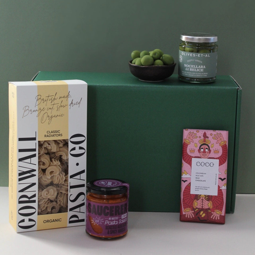 Pasta kit hamper against green background