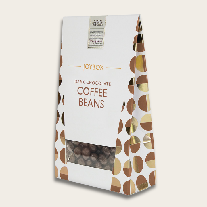 Packaging of Joybox Dark Chocolate Coffee Beans on a light beige background