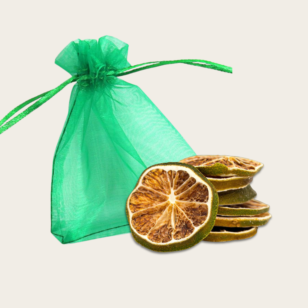 Stack of dried lime slices next to a green drawstring bag
