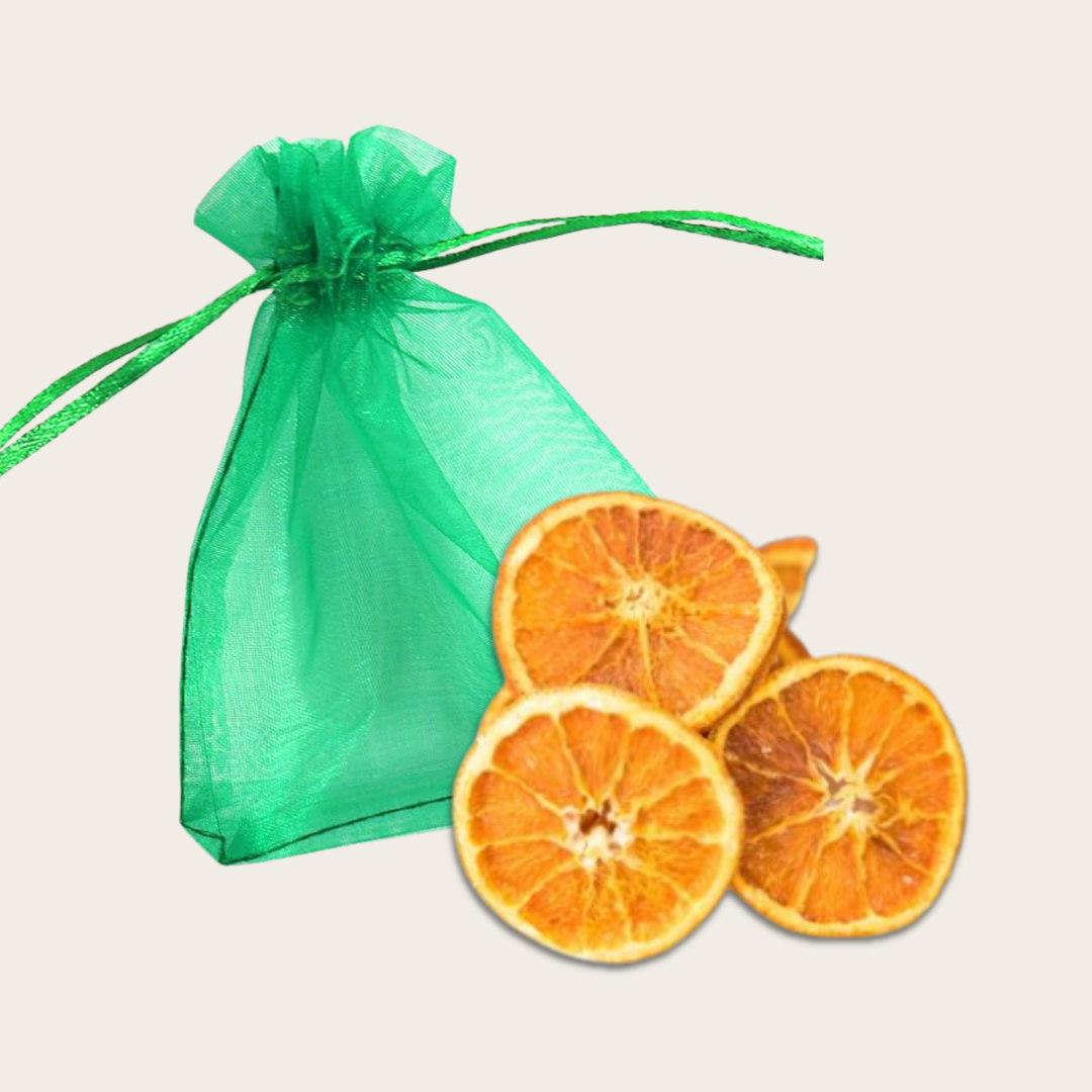 Green drawstring bag with dried orange slices