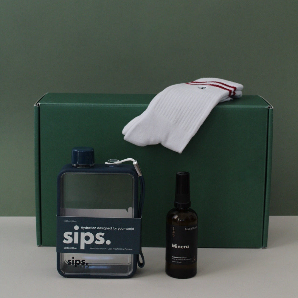 gift box with water bottle, socks and magnesium spray