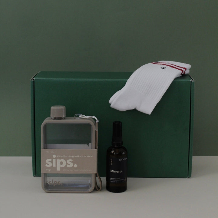grey water bottle, magnesium spray and athlete sock gift box